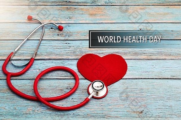 世界健康一天医疗保健医疗概念红色的听诊器红色的心蓝色的木背景