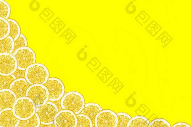 模式使新鲜的柠檬片黄色的背景复制空间开销视图平铺水果背景