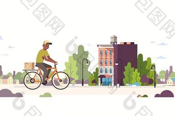 邮递员统一的骑自行车携带纸板包裹盒子非洲美国快递骑自行车在户外表达交付服务概念现代