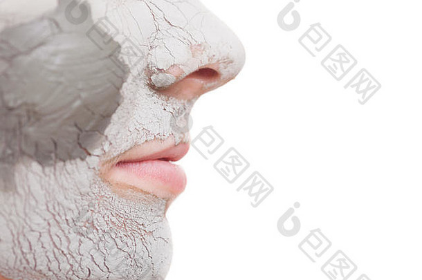 皮肤护理特写镜头女脸年轻的女人应用粘土面具女孩采取护理干compexion孤立的水疗中心美治疗