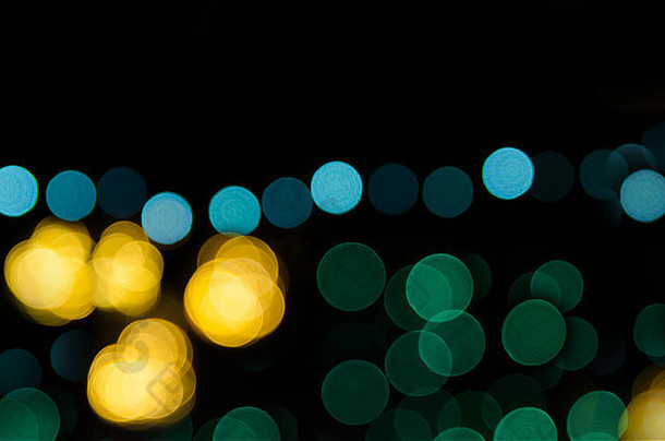晚上城市街灯摘要圆形散景背景圣诞之光