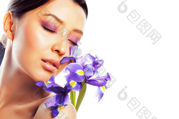 年轻的漂亮的亚洲女人花紫色的兰花关闭异醇
