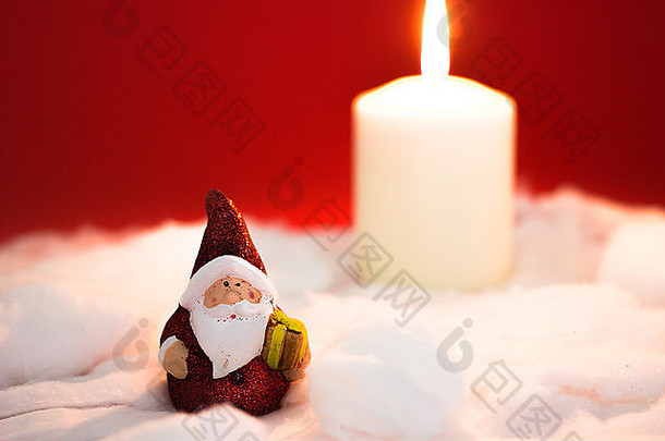 圣诞老人老人燃烧蜡烛红色的背景
