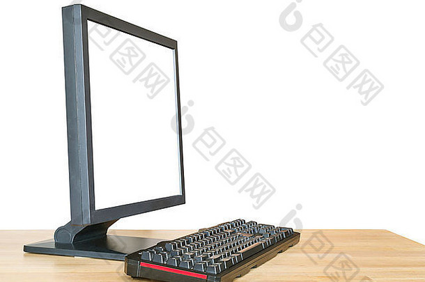 一边视图黑色的电脑显示减少屏幕键盘木表格孤立的白色背景