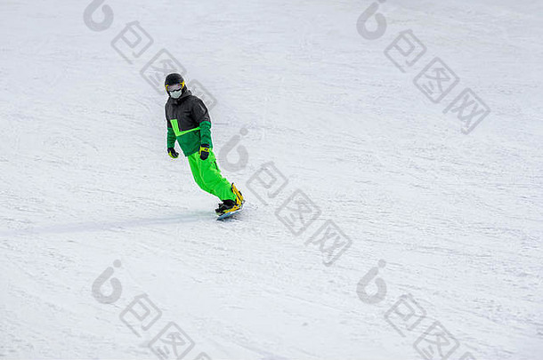 认不出来滑雪滑雪明亮的绿色西装保护眼镜面具坡工作服冬天体育运动休闲户外lifestile