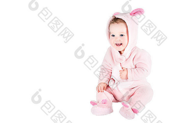 有趣的美丽的婴儿蓝色的眼睛穿兔子服装玩笑孤立的白色