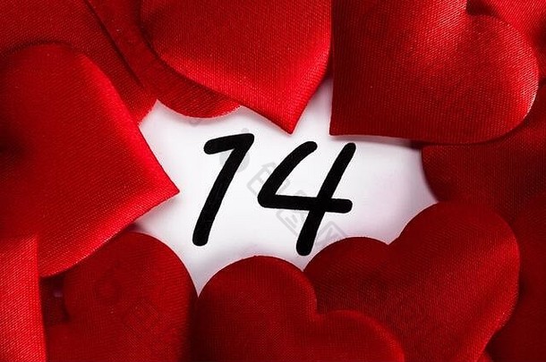 情人节一天红色的丝绸心日历2月日期背景爱庆祝活动概念