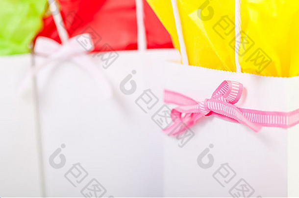 礼物袋色彩斑斓的纸粉红色的丝带袋白色