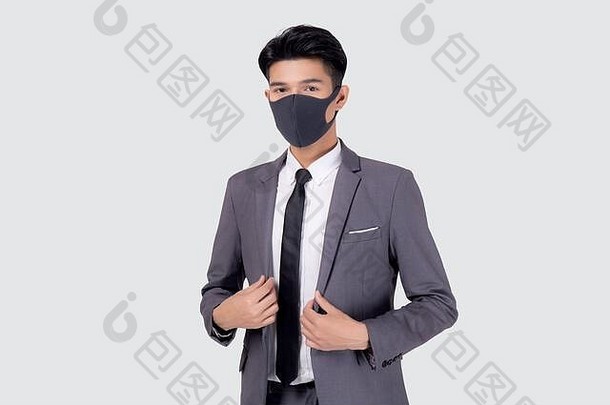 肖像年轻的亚洲商人西装自信穿脸面具保护科维德孤立的白色背景业务男人。医疗面具