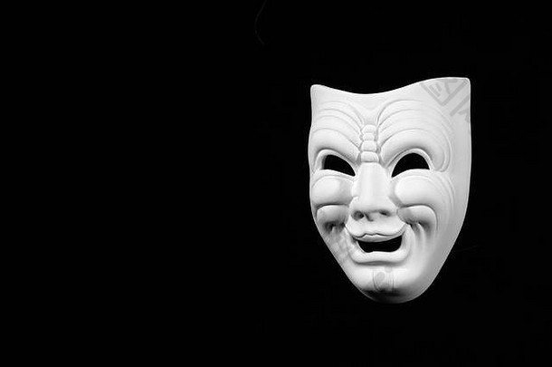 戏剧面具表现喜剧，黑色背景上的白色面具，文本可用空间