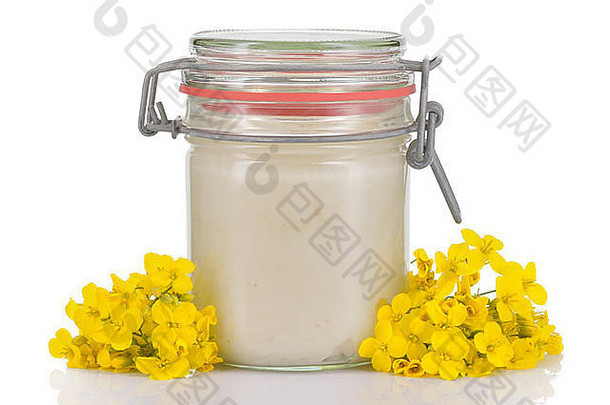 结晶油菜籽油菜蜂蜜玻璃Jar油菜籽花孤立的白色背景白色蜂蜜