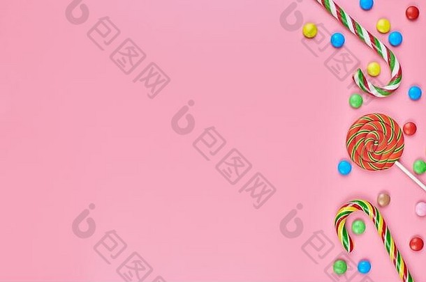 糖果棒棒糖糖果拐杖粉红色的背景复制空间爱色彩斑斓的甜品童年概念