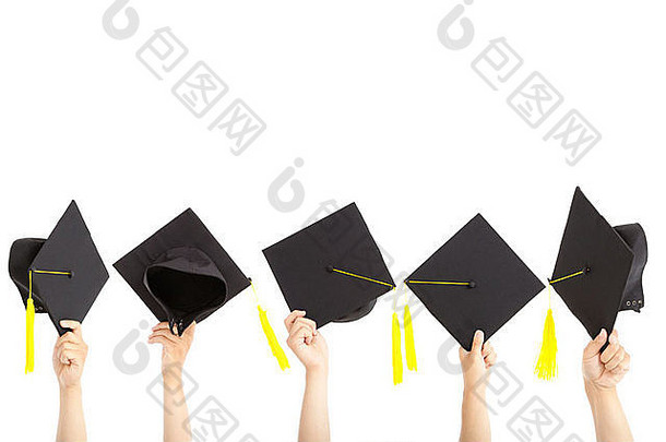 许多手拿毕业帽和白色隔离