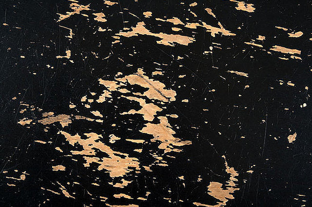 破旧的挠黑色的木表面黑色的剥油漆