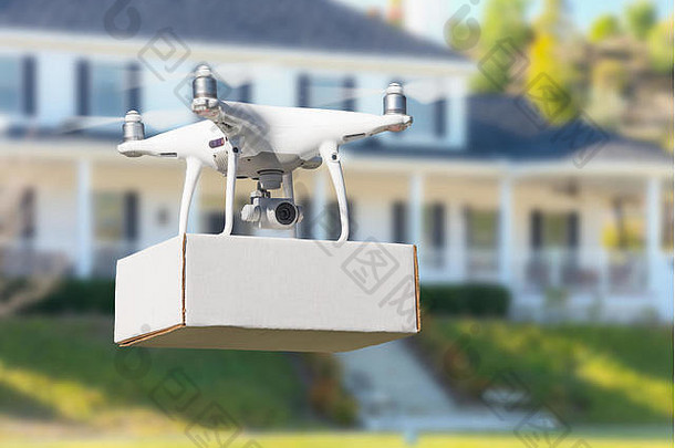 无人驾驶飞机系统（UAV）四旋翼无人机在屋内交付包裹。