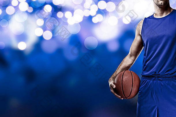 篮球球员蓝色的统一的蓝色的灯背景