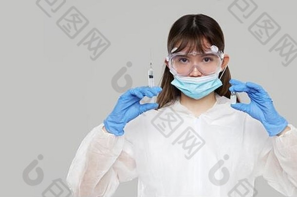 生物危害<strong>疫情</strong>中国人冠状病毒亚洲女人保护西装面具持有注射注射器疫苗疫苗