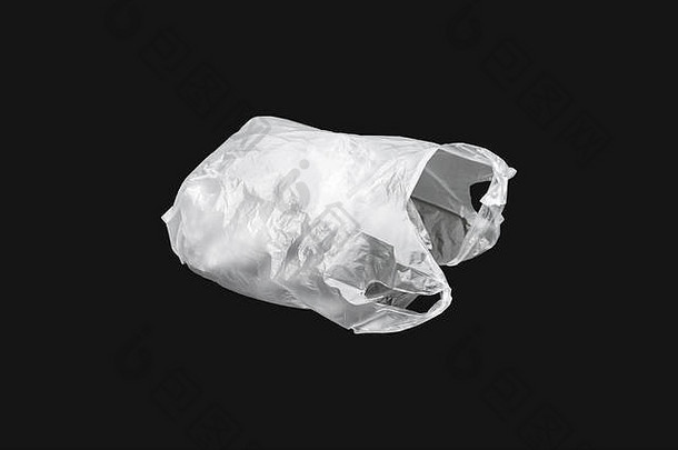 白色膨胀的塑料袋孤立的黑色的背景