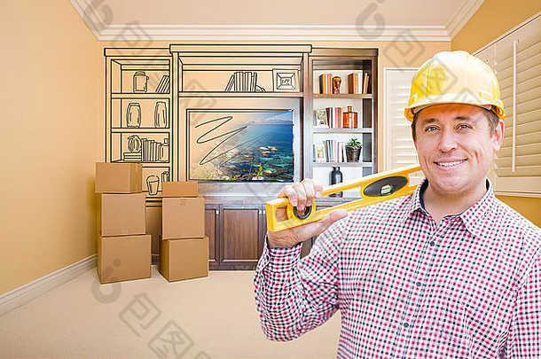 男建筑工人戴着安全帽在房间里，墙上有娱乐单位的图纸。