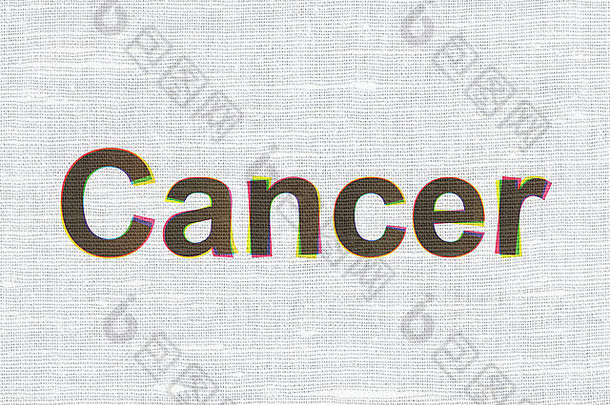 健康理念：织物纹理背景上的癌症