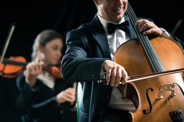 大提琴专业球员交响乐团管弦乐队执行音乐会背景