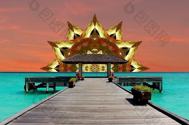 在一个热带天堂观看曼荼罗的太阳在绿松石海上落下。