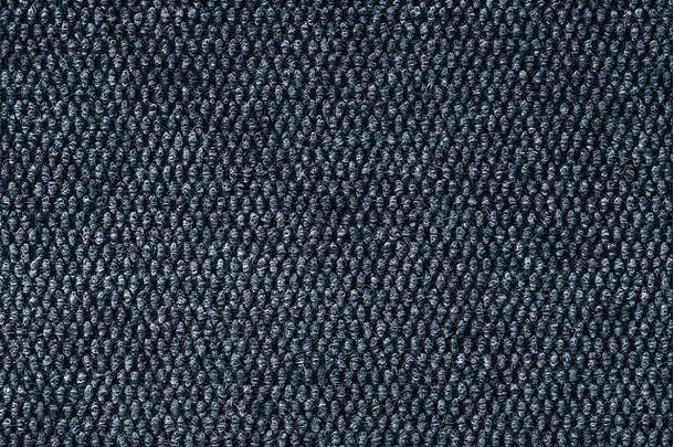 灰色粗糙的地毯纹理表面作为背景，详细的织物材质作为背景