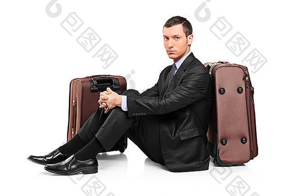 业务旅行者等待坐着手提箱