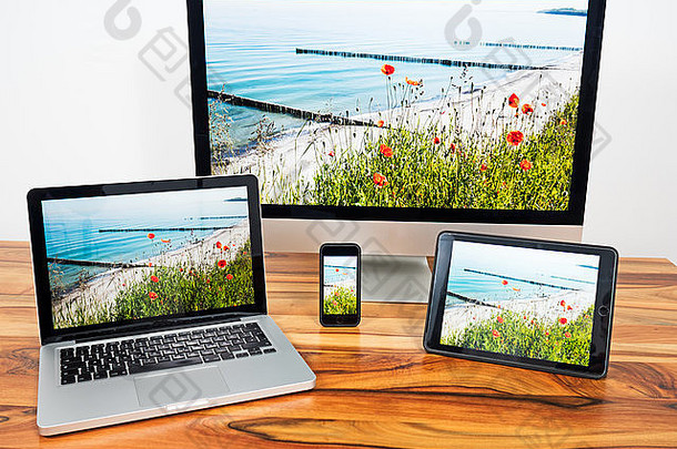 用笔记本平板电脑和智能手机vernetzter电脑用strandbild如果desktophintergrund