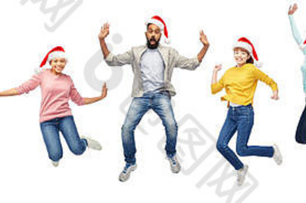 戴着圣诞帽的快乐的人们在空中跳跃