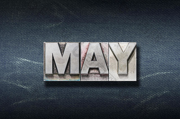 May <strong>word</strong>由深色牛仔裤背景上的金属凸<strong>版</strong>印刷而成