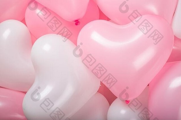 快乐情人节一天心形状的粉红色的白色气球背景