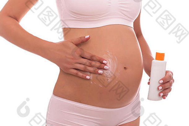 女手滋润怀孕了肚子奶油拉伸标志着条纹