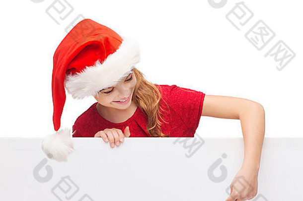 带白色白板的圣诞老人帽子的孩子