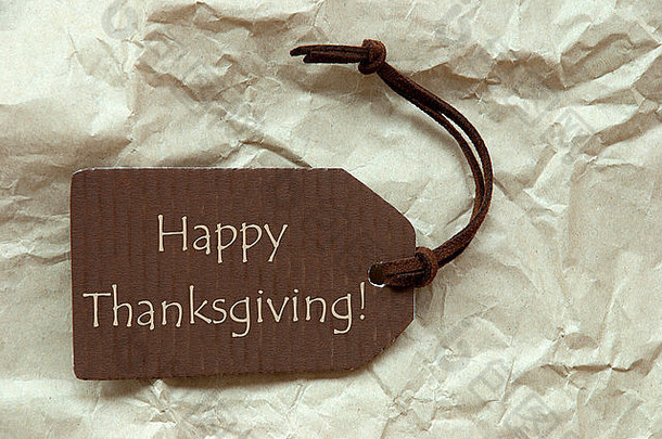 带快乐感恩节纸背景的棕色标签