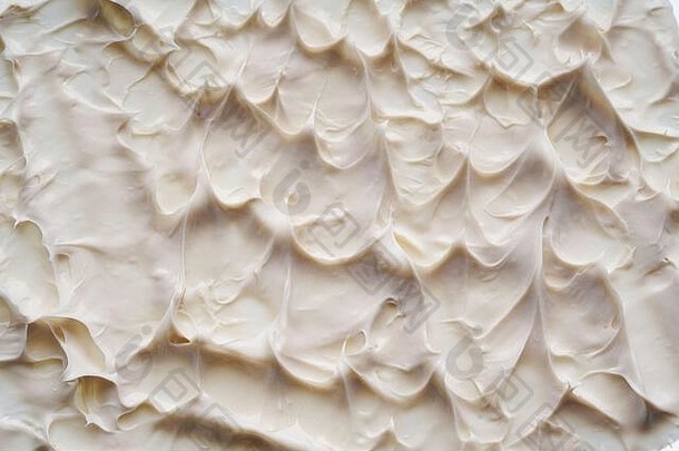 白色的污渍和质地，由隔离在白色背景上的面部粘土或奶油制成。