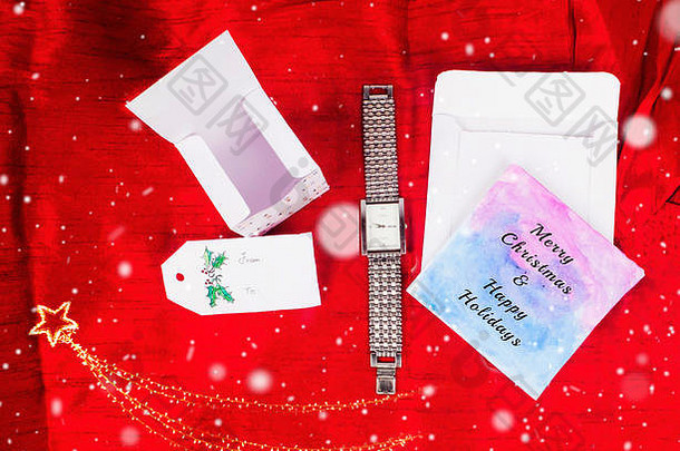 圣诞装饰，方形礼品盒，带男士手表礼品和贺卡，用于庆祝最佳圣诞假期邀请赛背景图片