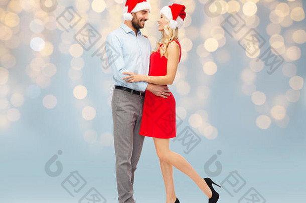 戴<strong>圣诞</strong>帽的幸福夫妇拥抱