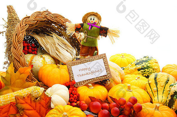 快乐的感恩节贺卡和稻草人在丰饶的秋季蔬菜中