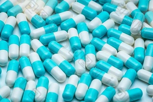 全框架抗生素胶囊药丸。蓝白色抗生素胶囊药丸纹理背景。制药业。保健和医学