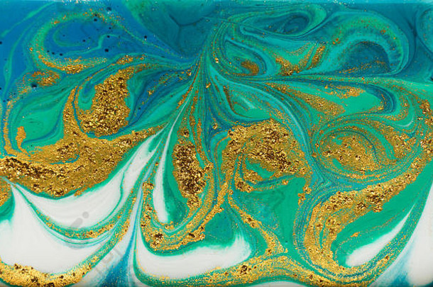 蓝色、绿色和金色大理石花纹图案。金色粉末大理石液体纹理。