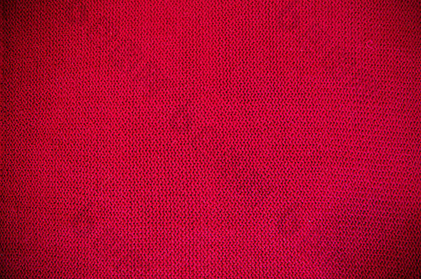 红色的针织模式羊毛毛衣纹理关闭手工制作的红色的针织羊毛纹理背景