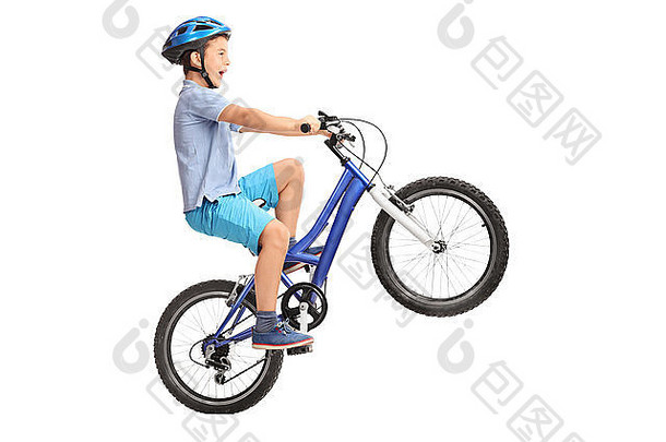 配置文件拍摄男孩蓝色的头盔滑轮小蓝色的自行车孤立的白色背景