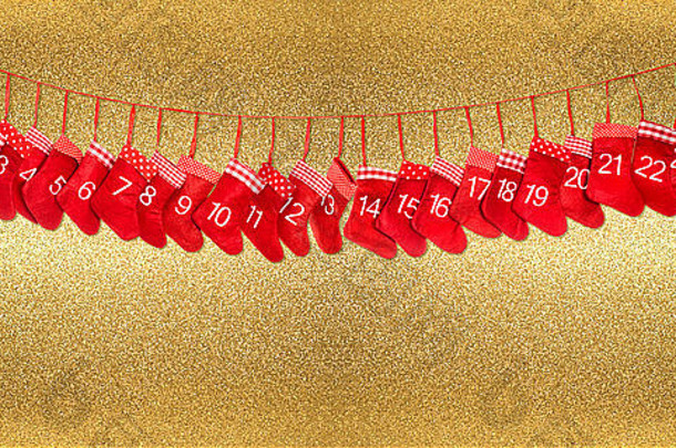 临期日历1-24。闪亮金色背景上的红色圣诞长袜装饰。假日横幅
