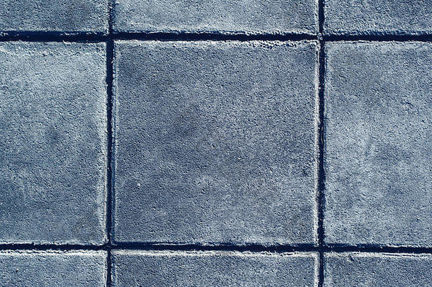 混凝土铺平道路纹理前视图平铺的灰色的广场形状的板