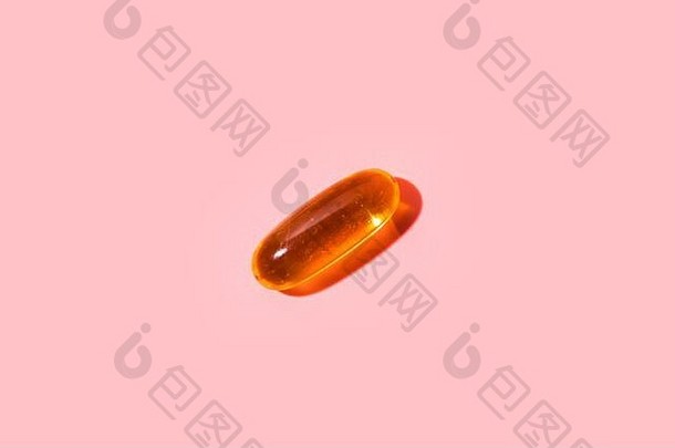 一片粉红色背景的欧米茄3药丸。平坦的地面上有刺眼的光线和阴影。简约风格