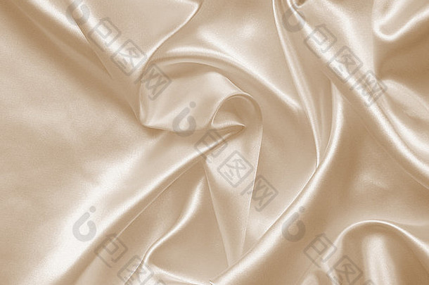 光滑优雅的金色丝绸可以用作婚礼背景。深褐色调。复古风格