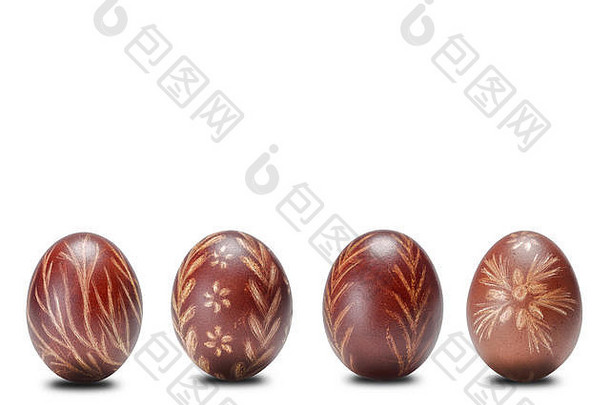 白色背景上有四个棕色的复活节彩蛋