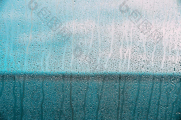 滴水雨湿玻璃背景喜怒无常的照片冷蓝色的颜色