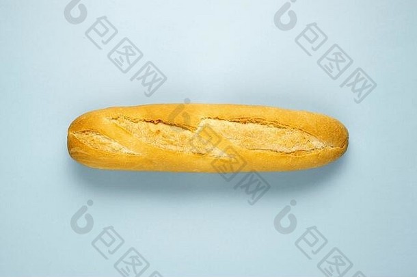 创意食品健康饮食概念图蓝色背景上切片的烤熟糕点面包。